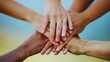 © Seak - A close-up of hands of different ethnicities coming together to symbolize unity and cultural diversity.