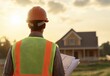 © SunPunjiStudio - Construction Worker Observing New Home Development at Sunset