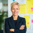 © Robert Kneschke - Confident female executive smiling in modern office setting