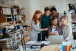 © Geber86 - Group of young people using a smart phone together in the office