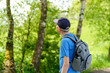 © PeterPike - Senior man with backpack hiking in the forest. Travel and active lifestyle concept.