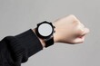 © Fazila - blank round smart watch on wrist, empty screen smart watch mockup. Female wrist. Minimalistic.