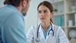 © Yanina - professional female doctor with stethoscope listens attentively to patient, medical consultation, healthcare, trust and professional care