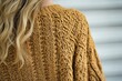 © Alena - Close-up shot of a person wearing a sweater