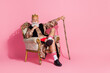 © deagreez - Photo of confident thoughtful man casino winner wear stylish print costume sitting king throne isolated on pink color background
