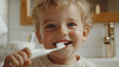 © Infinity Lens - Portrait of happy smiling little boy brushing or washing his teeth with toothbrush isolated. male child or kid mouth dental hygiene and health care, morning bathroom routine, stomatology, oral, fresh.