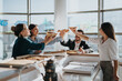 © qunica.com - A group of colleagues enjoy a casual pizza party in a modern office setting, celebrating teamwork and success. Their cheerful interaction highlights a positive and collaborative work environment.