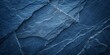 © Edwin - Dark blue slate rock texture background with rough and cracked stone layers, creating a natural, rough surface. Abstract design.