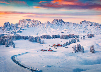 Fototapete - Unbelievable morning view of Alpe di Siusi village. Great winter sunrise in Dolomite Alps. Cold outdor scene of ski resort, Ityaly, Europe. Beauty of countryside concept background.