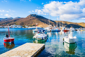 Wall Mural - Boats anchoring in Katapola port with sea and mountains in background, Amorgos island, Cyclades, Greece