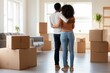 © JoseManuel - Rear view of couple embracing while looking at moving boxes