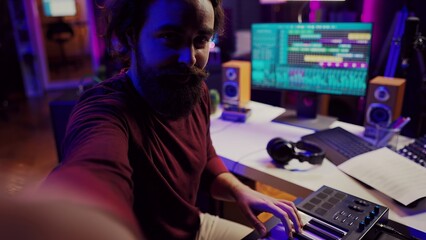 Leinwandbilder - POV of musician playing on synthesizer for online piano lessons in his home studio. Singer songwriter filming vlog teaching about musical instruments, midi controller keyboard. Camera A.