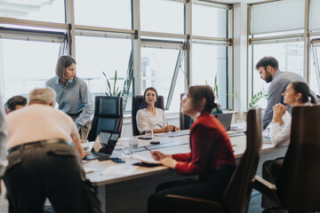 Wall Mural - A group of multicultural business people engaged in a meeting within a modern office setting, brainstorming and discussing solutions. They represent diverse ages and backgrounds.