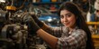 © Maxim Borbut - A young Asian female mechanic working in a workshop surrounded by tools and equipment.A young adult Asian mechanic in a workshop amidst tools and equipment.An Asian young female mechanic in a