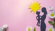 © Maxim Borbut - A pink background features the silhouette of a woman and child with flowers
