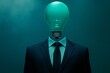 © Halina Berah - A light bulb crowning a figure in a dark suit stands for ideas and creativity.
