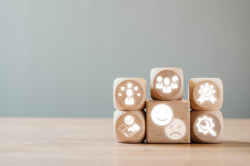 Wall Mural - wooden blocks with feedback icons symbolizing communication, improvement, and teamwork on a wooden t