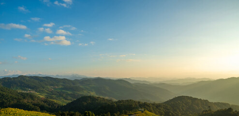 Poster - Natural landscape sunset sky on top of mountain and valleys.