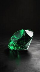 Poster - Stunning emerald gemstone exhibits rich green hues on dark surface under soft lighting in a tranquil setting