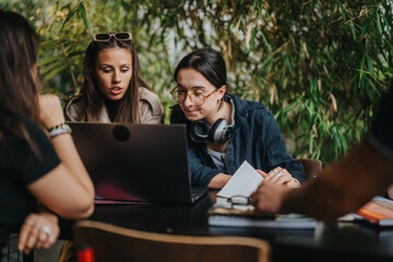 Poster - Young students studying together at a trendy coffee bar, surrounded by lush green plants, engaging in focused collaborative learning on a laptop, creating a vibrant and modern academic environment.