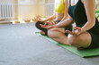 © leroy - A group of young women engage in yoga meditation session, focusing on balance, calm, and connection with a serene and tranquil atmosphere