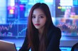 © Suthiporn - Young Asian Woman Using Tablet for Generative AI Marketing in Office Balancing Work and Life