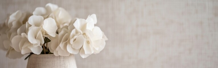 Poster - Elegant off-white wallpaper complements a decorative vase with delicate flowers in a stylish interior setting