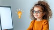 © Meddiistocker - A child using a computer with a lightbulb icon on the screen, representing creativity and innovation for stocking photo with whitespace