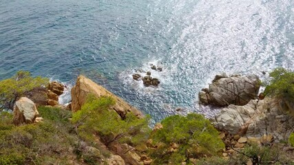 Wall Mural - Coastal Serenity: Rocky Shoreline and Sparkling Ocean Waves