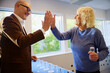 © Johnér - Corporate colleagues giving high-five during leisure game competition