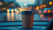 © Izzain - A takeaway coffee cup sits on the dashboard of a car at night, the city lights blurred in the background. Warm tones and cool blues create a cozy vibe.