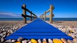 © KAMOLPOP - Blue Wooden Pathway to the Sea: A vibrant blue wooden path winds its way towards the shimmering sea horizon, promising adventure and escape.