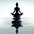 © Ram - Silhouette of a meditating figure balancing on stacked stones in calm water, symbolizing peace, balance, and mindfulness, ideal for wellness, meditation, and holistic designs