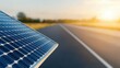 © Kin no Hikari - Solar panel on road with sunset background, showcasing renewable energy.