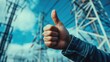 ©  AugmentArt - Thumbs up gesture promoting clean energy concept with power lines in the background emphasizing support for alternative electricity sources.