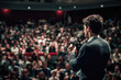 © romanets_v - Young caucasian male speaker addressing a large audience at a conference event