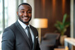 © romanets_v - Confident african adult male in business suit smiling indoors