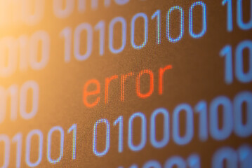 Wall Mural - close up of computer screen with inscription error between binary code. 1 and 0 digit code on comput