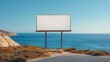 © zuriya - Empty billboard on a sunny seaside, featuring a clear blue sky and ocean backdrop, offering space for advertising in a serene setting