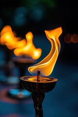 Poster - Flames dance atop small brass lamps.