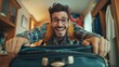 © vefimov - A man poses with his luggage, showing excitement for an upcoming trip.