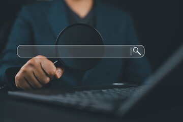 Leinwandbilder - Businessman using a laptop show a search bar. Concept of keyword search engines, SEO optimization, tool digital online. A website to find a job and career on the internet, web browser information