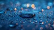 © Kenny Parker - Artistic macro image showcasing water droplets on smooth surface glowing under soft blue light
