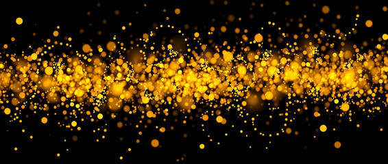 Wall Mural - Abstract Gold Glitter Particles on Black Background