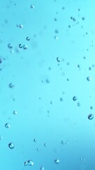 Poster - Super Slow Motion of Flying Water Drops, Isolated on Blue Background. Filmed on High Speed Cinema Camera, 1000fps.