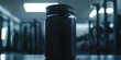 © vstudio - Black protein powder container mockup on gym table showcasing fitness and health