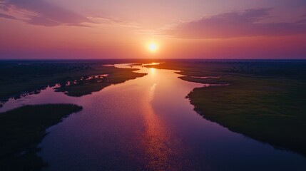 Sticker - Aerial view of the serene Okavango river at sunset, capturing the tranquil beauty of the landscape. The vibrant colors create a stunning scene, offering ample photo style copy space.