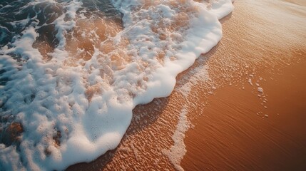 Sticker - Close-up view of a sandy beach with waves crashing against the shore, capturing the essence of natures beauty. Ideal for highlighting the tranquility of a sandy beach scene with ample copy space.