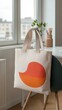 © kittipoj - Chic Minimalist Workspace with Vibrant Accents and Trendy Tote Bag