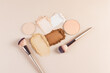 © ADDICTIVE STOCK - Various types of face powders and brushes arranged neatly